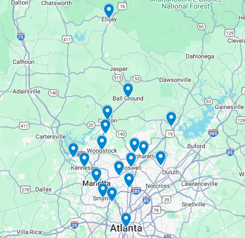 A person is standing next to a pipe in the dirt.