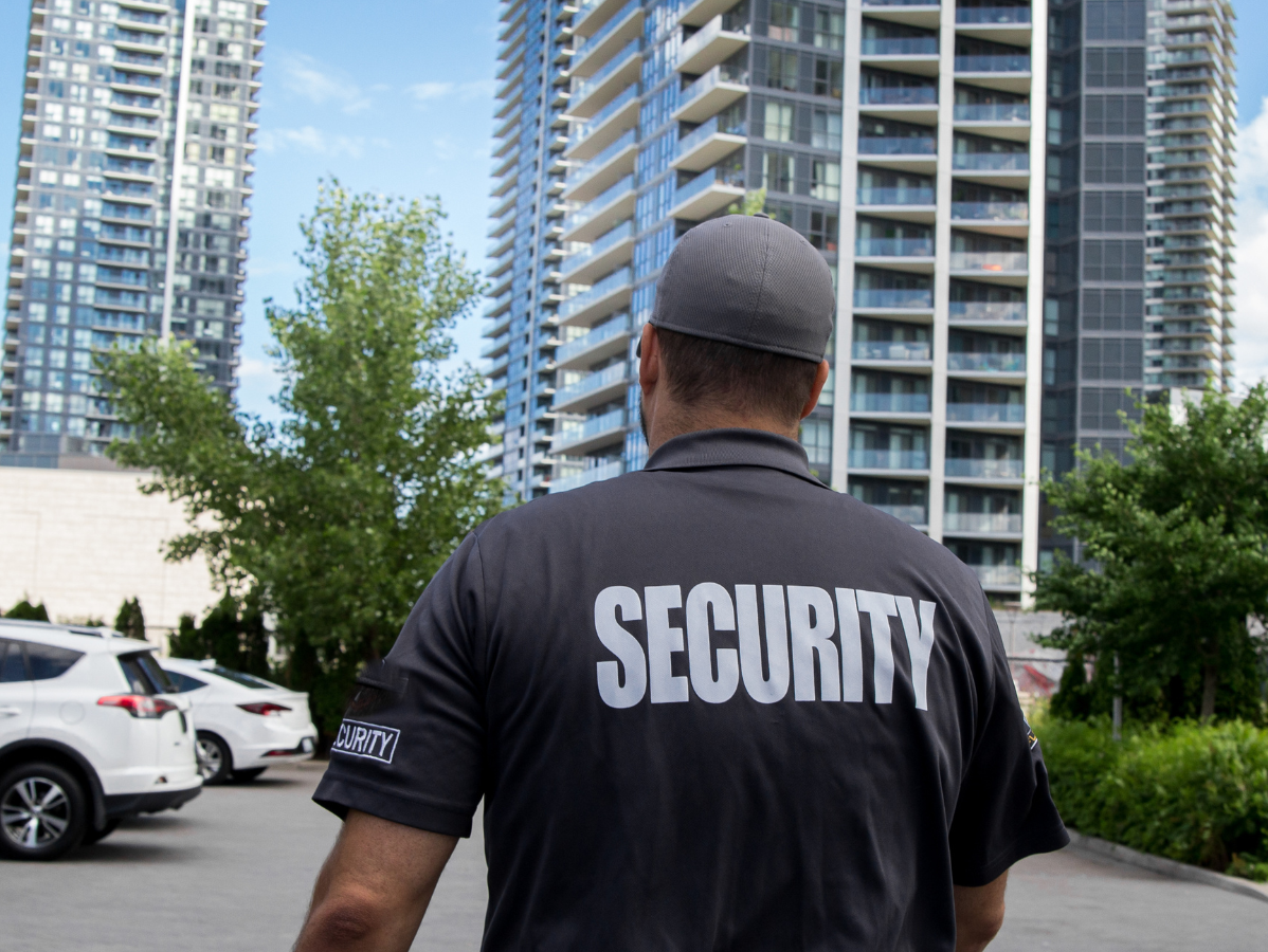 Security guard in gray shirt with 