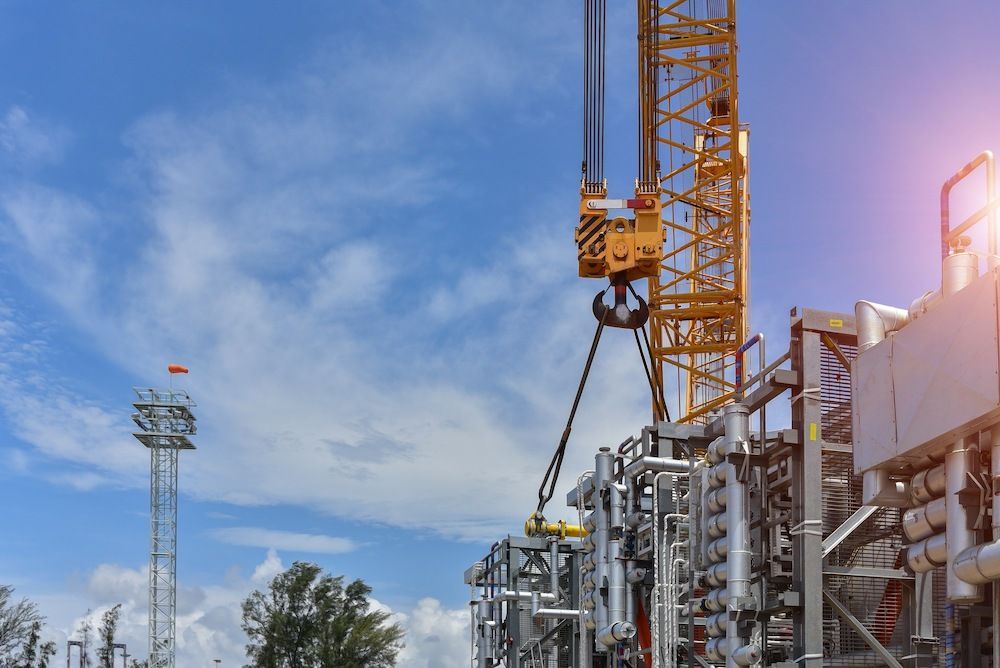 A Construction Site with A Crane and A Blue Sky in The Background — Linmar Cranes & Haulage in Julia Creek, QLD