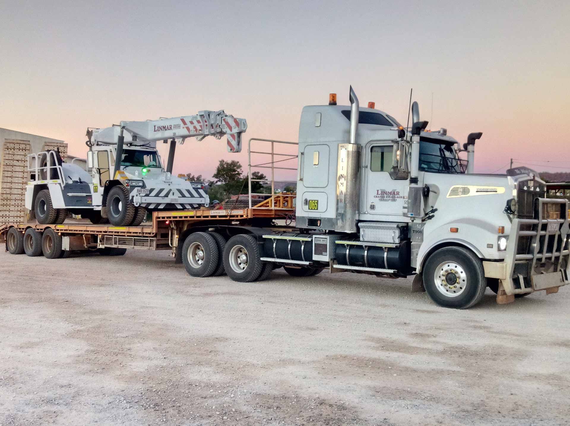 A Semi Truck with A Crane on The Back of It — Linmar Cranes & Haulage in Birdsville, QLD