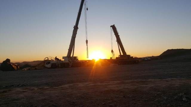 A Sunset With Two Cranes in the Foreground — Linmar Cranes & Haulage in Kalkadoon, QLD