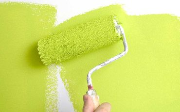 painting a wall with a roll