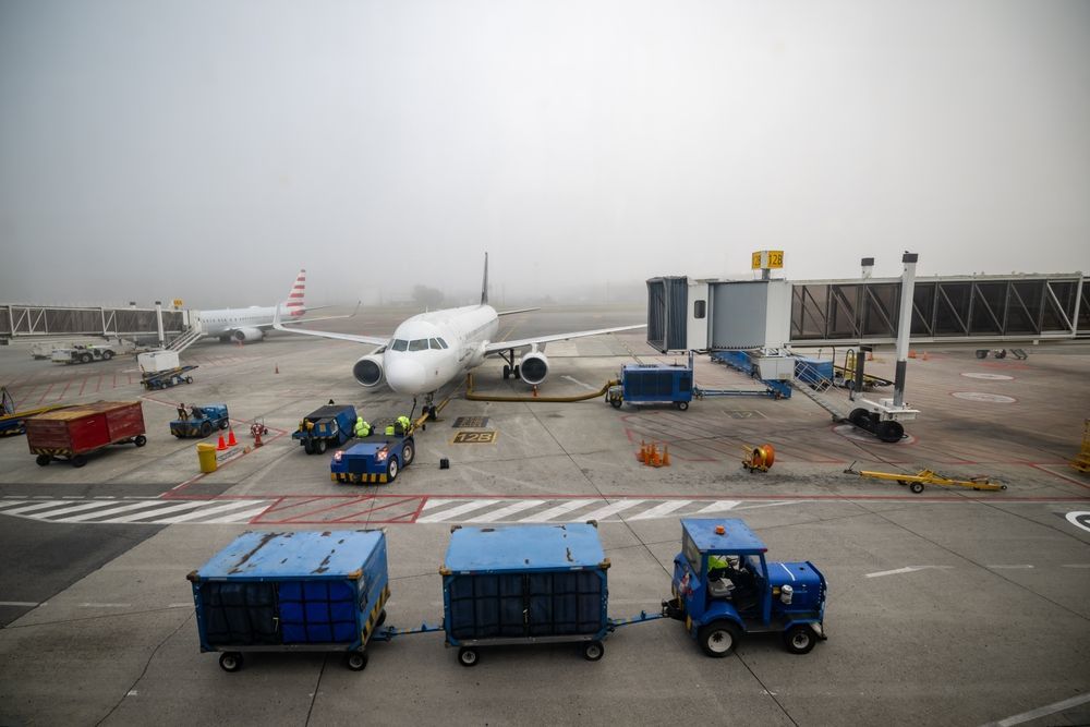 An airplane is parked on the tarmac at an airport.