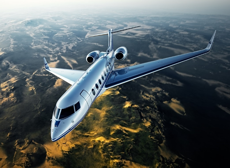 Private jet soaring above scenic Australian landscape showcasing luxury and exclusivity for high-net