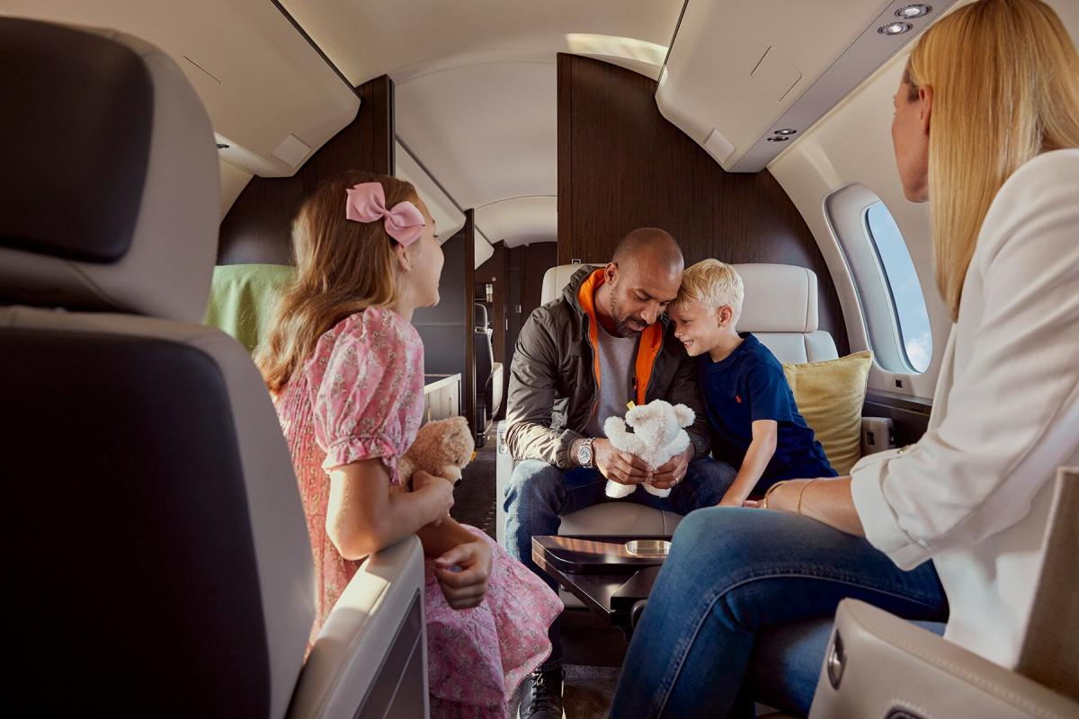 A family is sitting on a private jet.