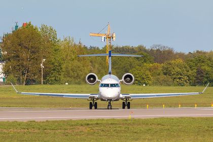 a large jetliner sitting on top of an airport runway