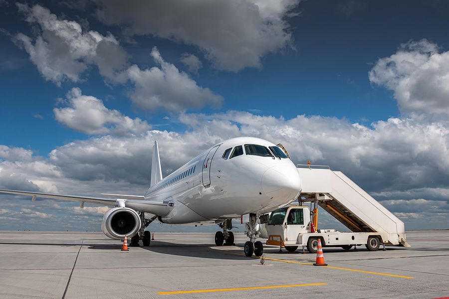 a large jetliner sitting on top of an airport tarmac