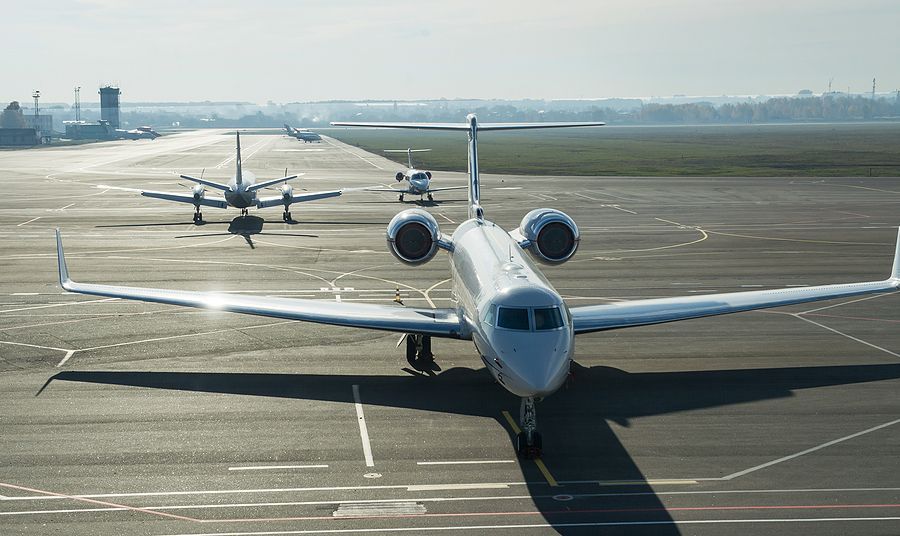 a couple of airplanes that are on a runway