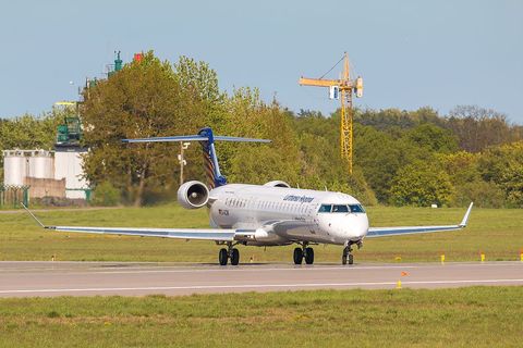 a large jetliner sitting on top of an airport runway