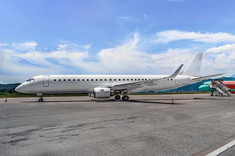 a large jetliner sitting on top of an airport tarmac