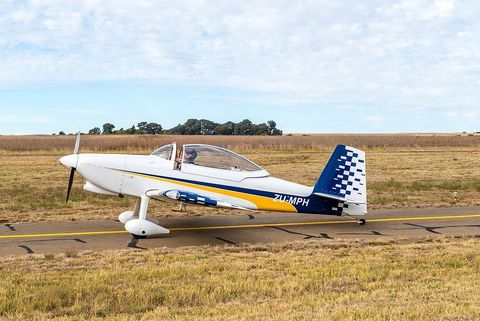 a small plane is sitting on a runway