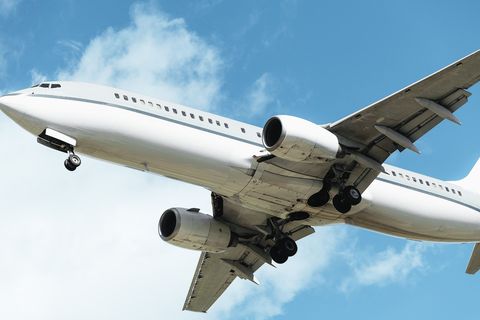 a large jetliner flying through a blue sky