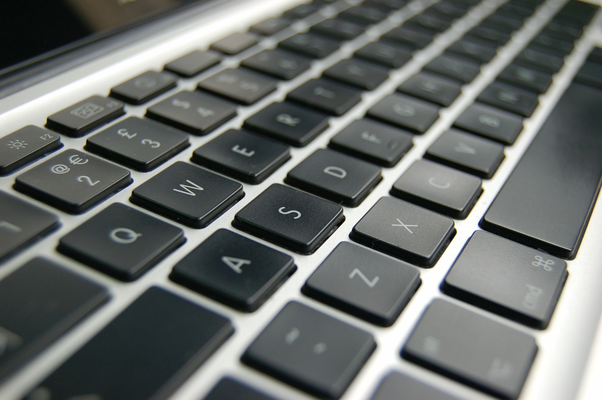 A close up of a keyboard with the letters a and z visible