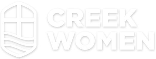 A white logo for creek students with a shield on a white background.