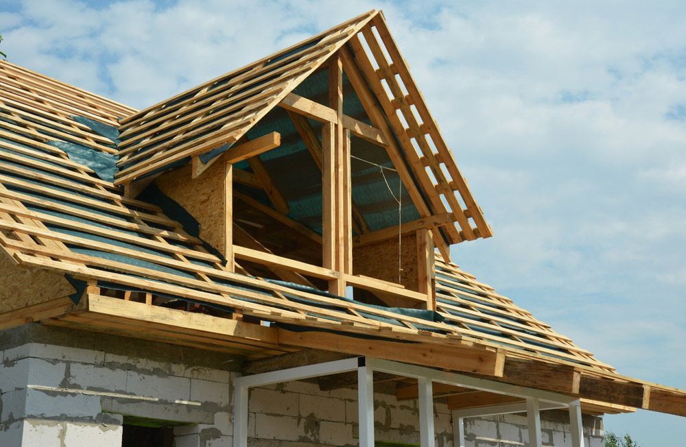 Roof Framing Of An Attic With Vapor Barrier — Trussted Frames & Trusses in Central Coast, NSW
