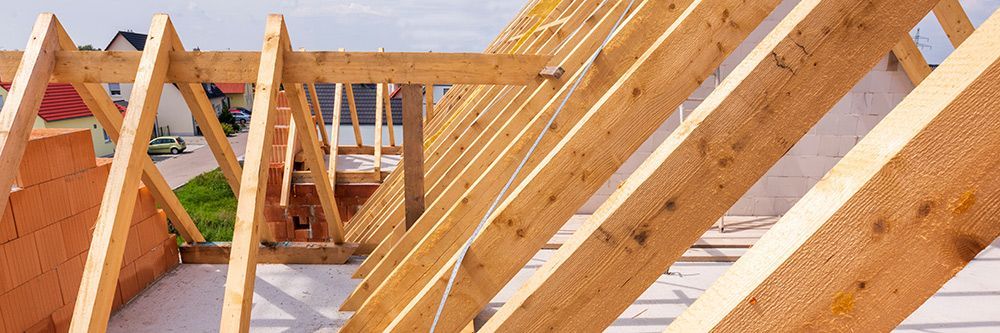 Large Roof Truss In Construction Of A Newly Built House — Trussted Frames & Trusses in Cessnock, NSW