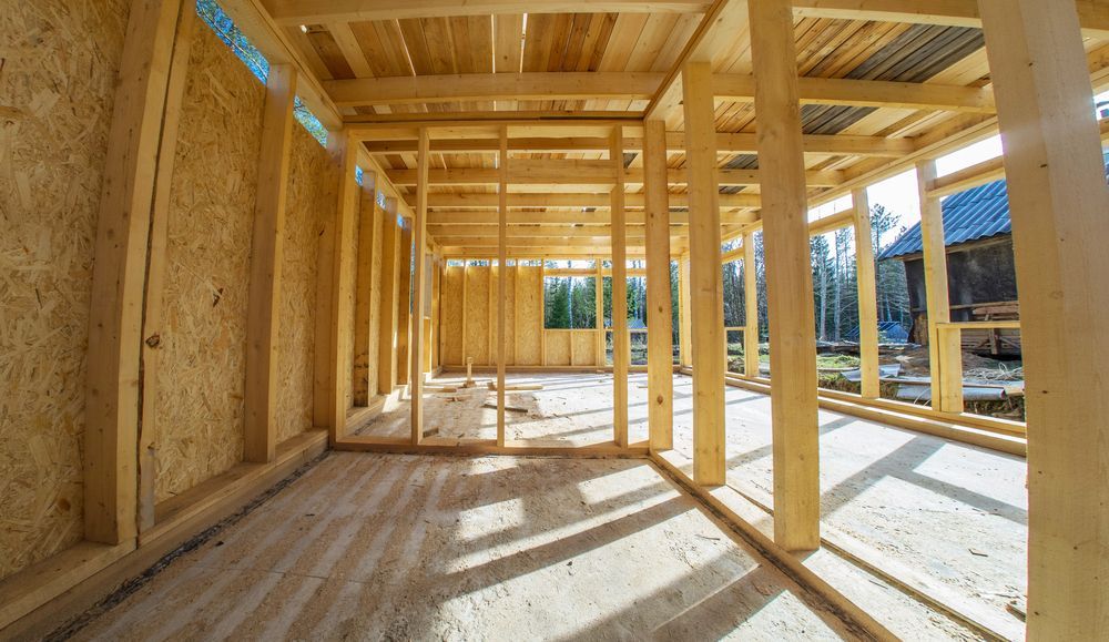 The Inside of A Wooden House Under Construction — Trussted Frames & Trusses in Bennetts Green, NSW