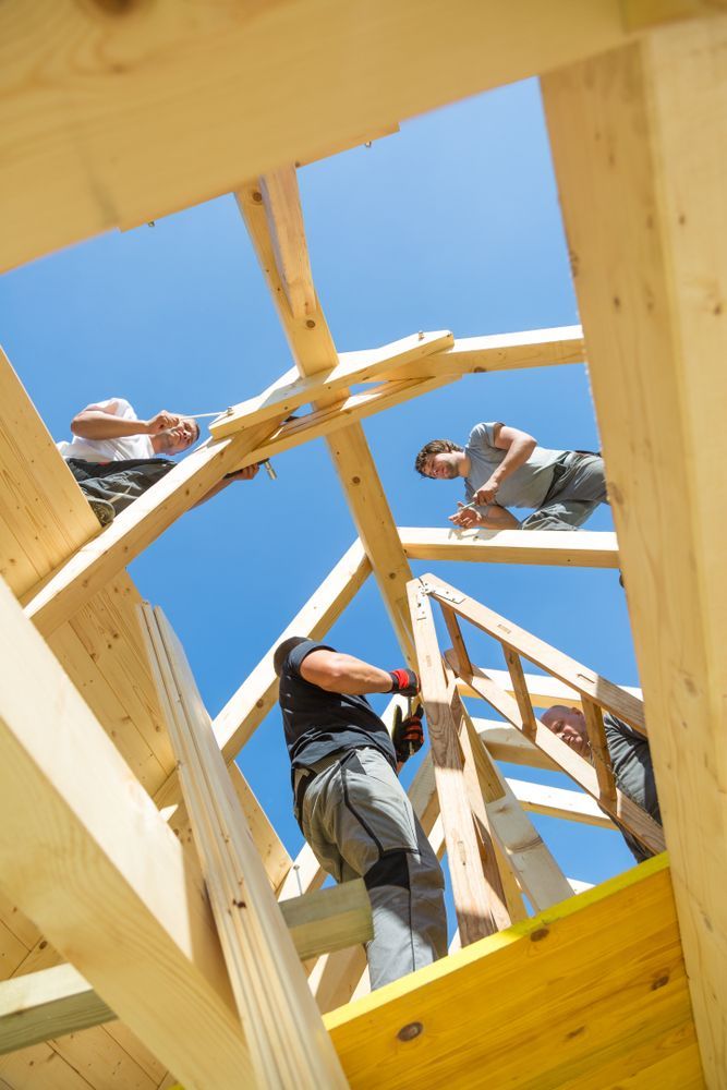 A Group of Men Are Working on A Wooden Structure  — Trussted Frames & Trusses in Tamworth, NSW
