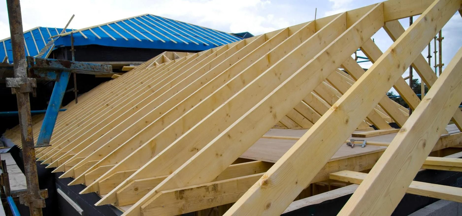 The Roof of A Building Is Being Built with Wooden Beams —Trussted Frames & Trusses in Bennetts Green, NSW