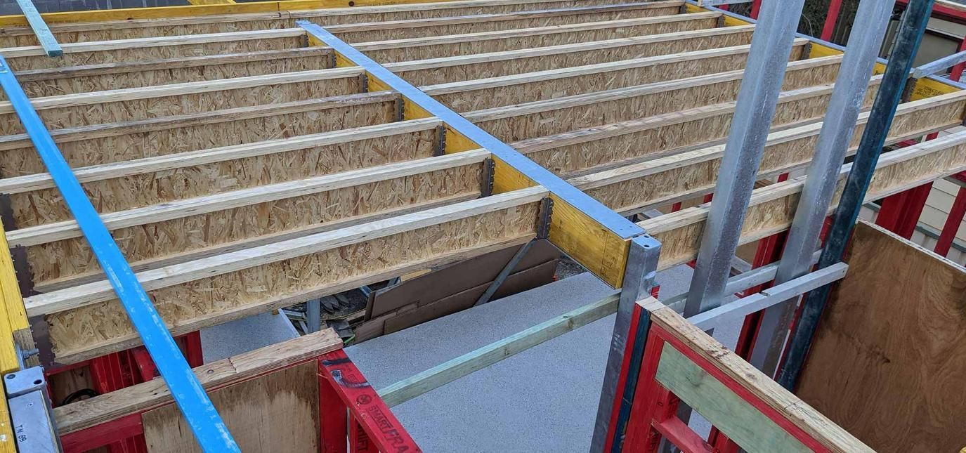 A Close up Of a Wooden Floor in A Building Under Construction — Trussted Frames & Trusses in Bennetts Green, NSW