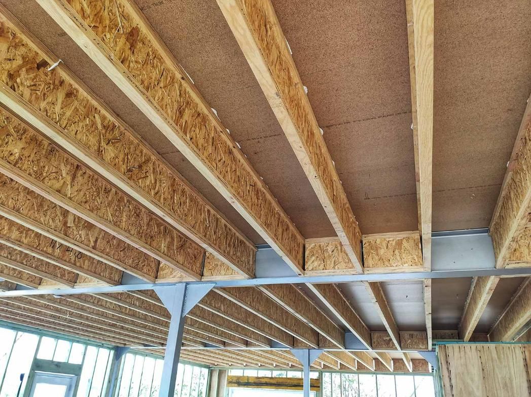 The Ceiling of A Building Under Construction with Wooden Beams — Trussted Frames Trusses in Bennetts Green, NSW
