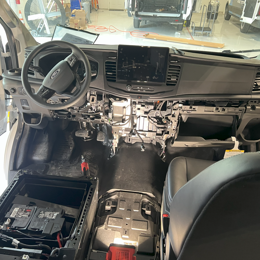 A tear-down of the interior of a Ford vehicle to install a custom switch module, giving the operator convenient control over all installed emergency and auxiliary lighting features. This upgrade improves usability, keeps controls within easy reach, and ensures the vehicle is ready for reliable service in the field.