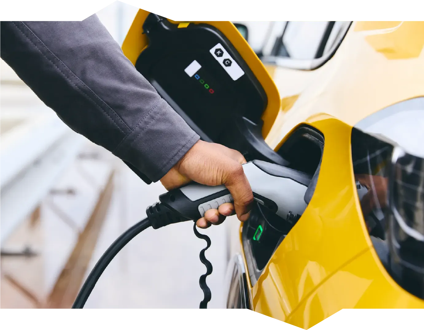 A person is opening a car door with a key.