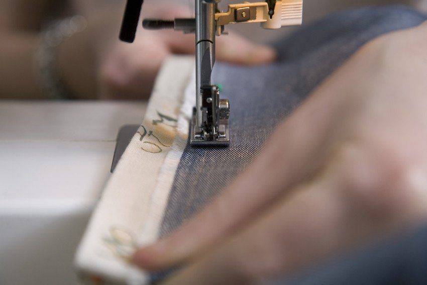 Close up of hands & sewing machine
