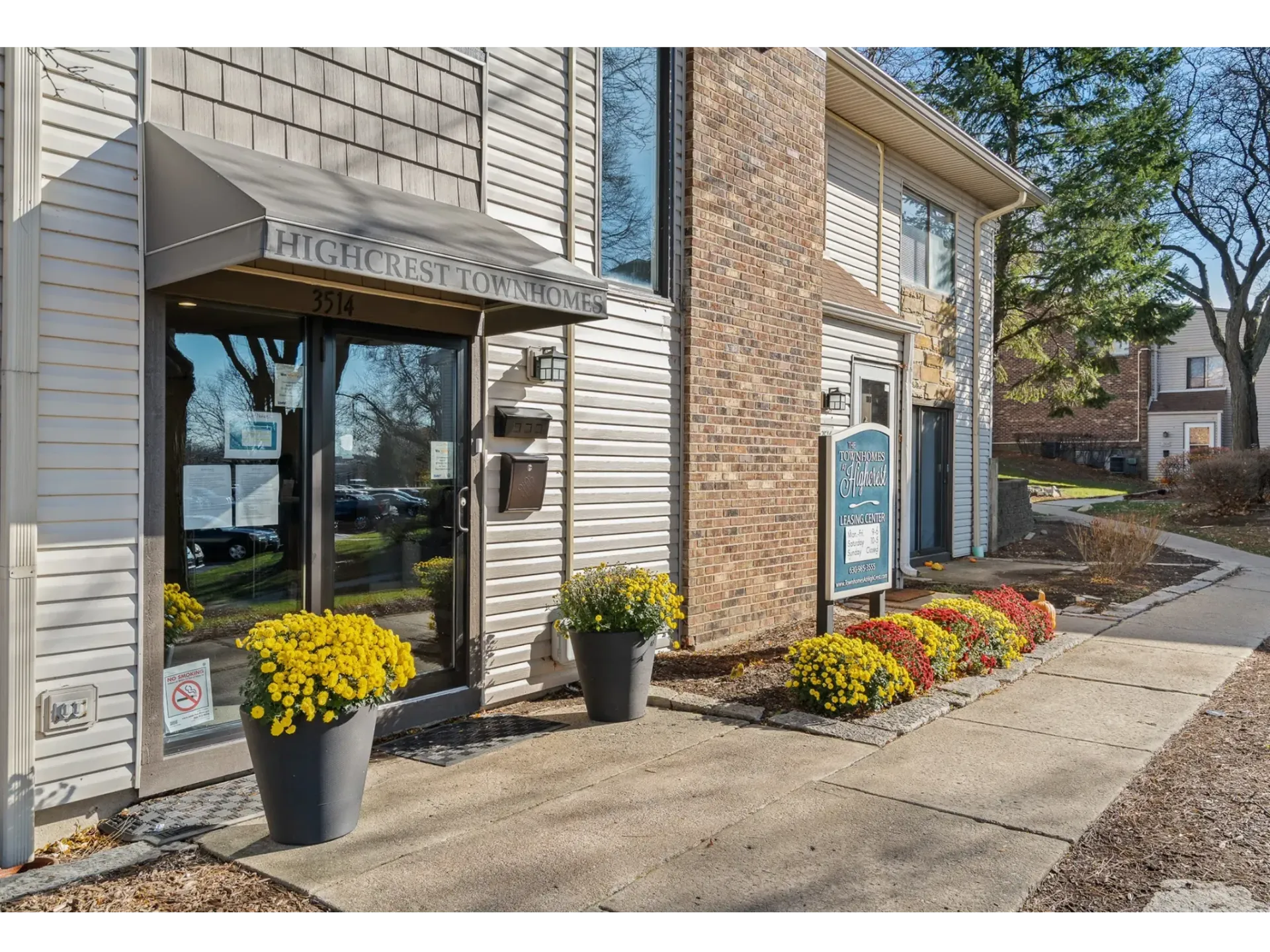 Exterior view of Highcrest Townhomes entrance with flower pots
