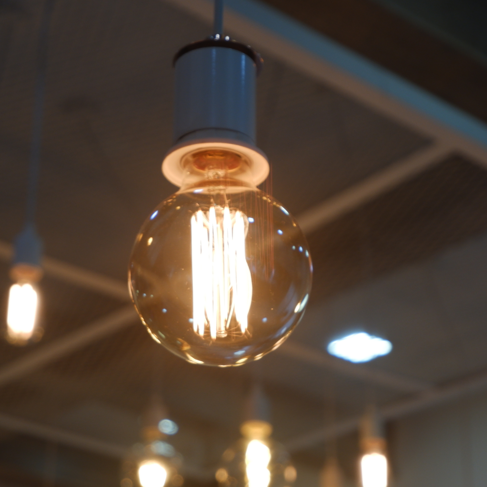 Air conditioning units with toolbox and gloves in backyard.