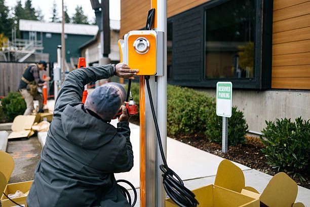 Air conditioning units with toolbox and gloves in backyard.