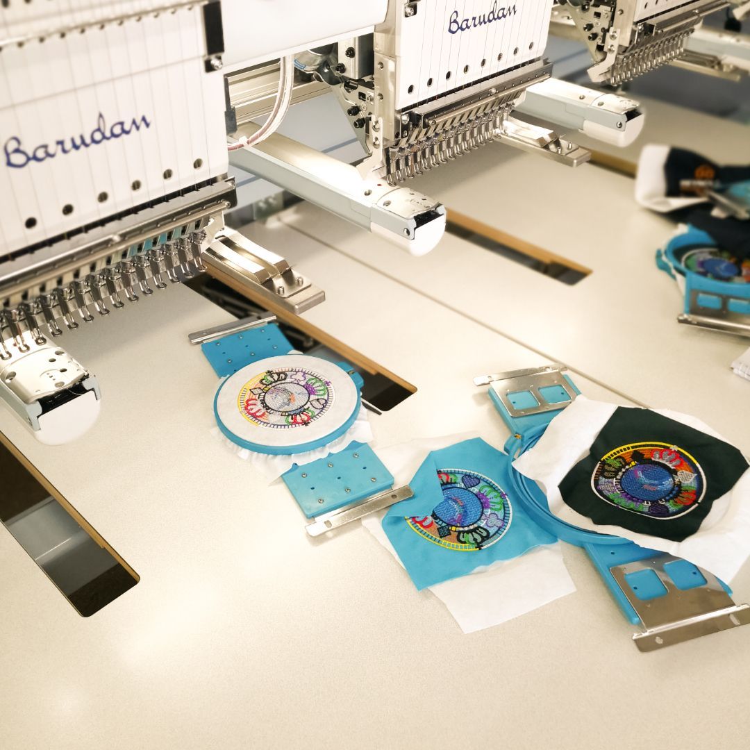 A Close Up of a Sewing Machine Embroidery on a Piece of Fabric — NMTG Embroidery In Shellharbour, NSW