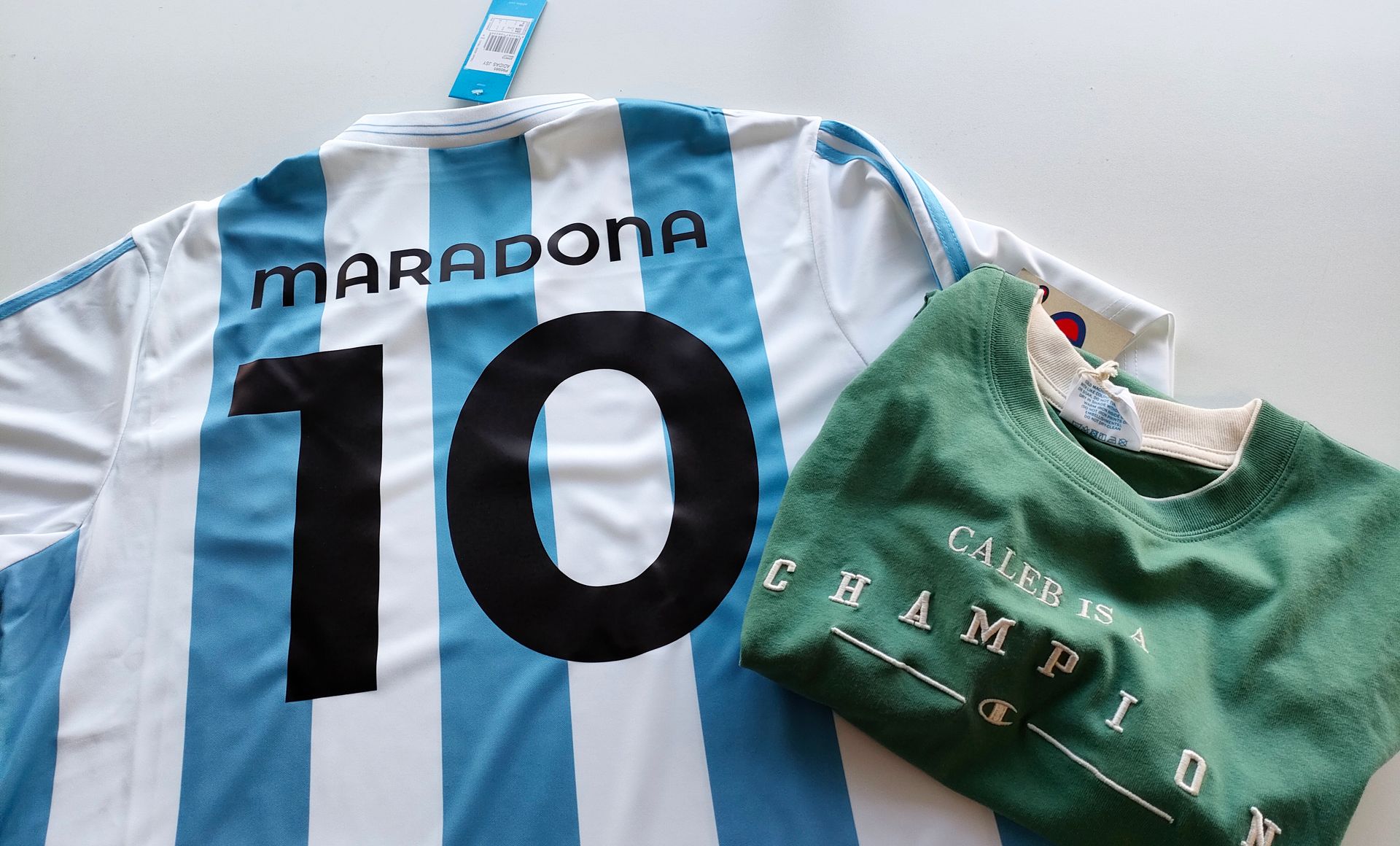 A Blue And White Striped Sports Shirt And Green Sports Shirt— NMTG Embroidery In Wollongong, NSW