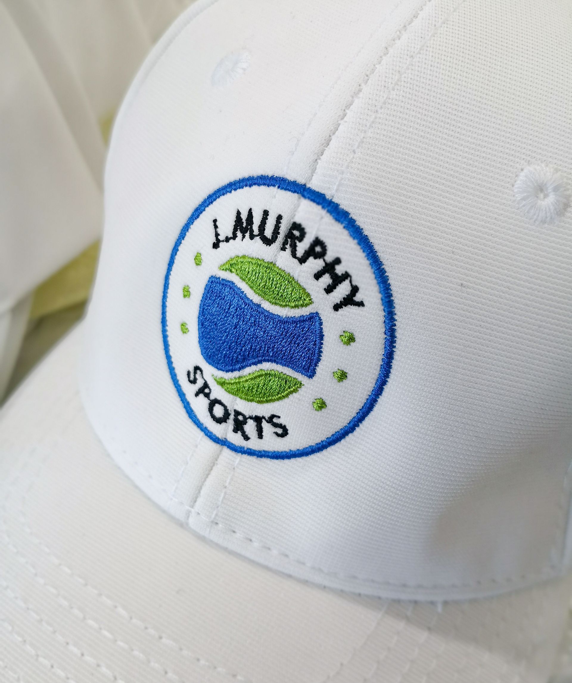 A Tennis Hat With Personalised Embroidery — NMTG Embroidery In Wollongong, NSW