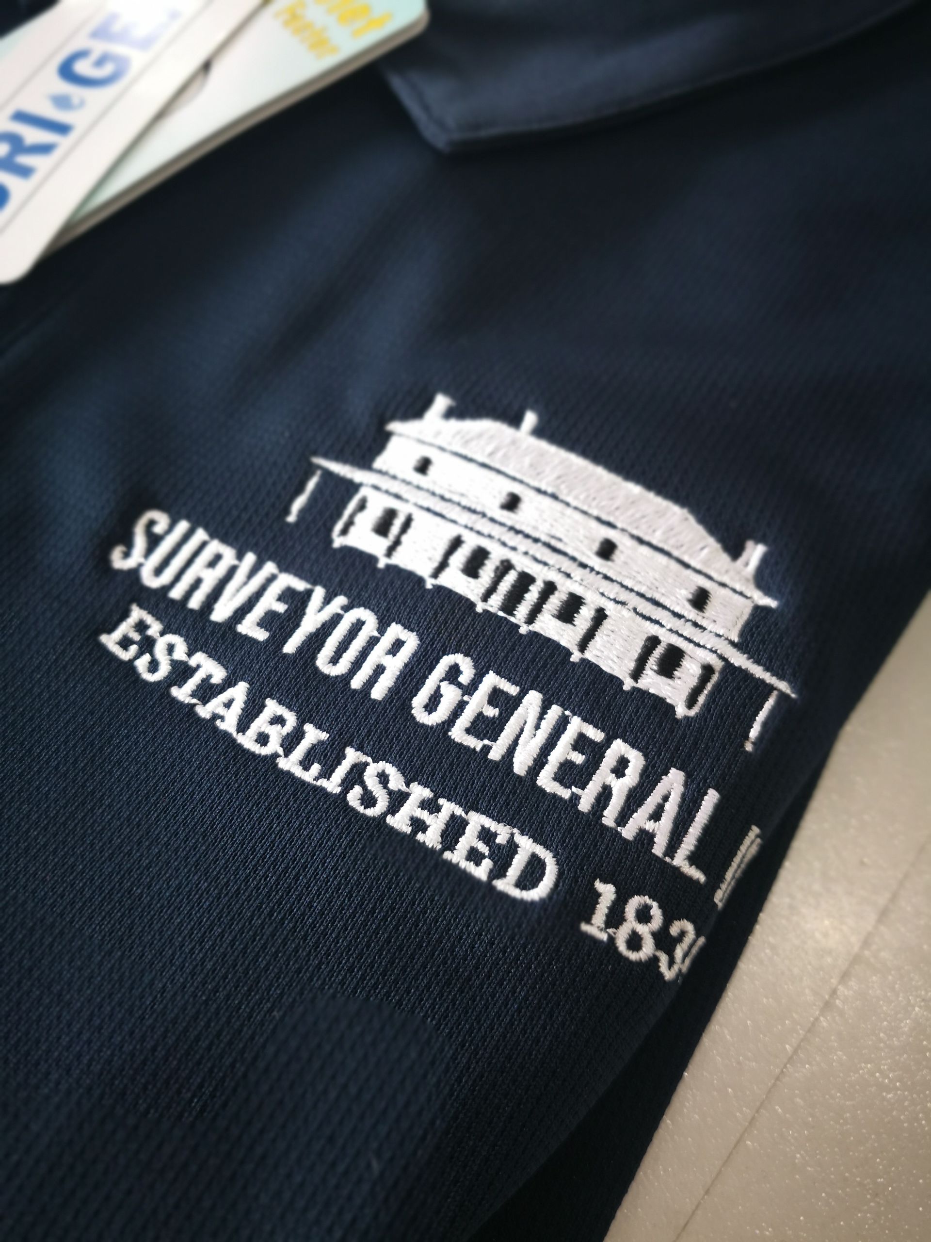 A Surveyor Uniform In Navy Blue — NMTG Embroidery In Wollongong, NSW