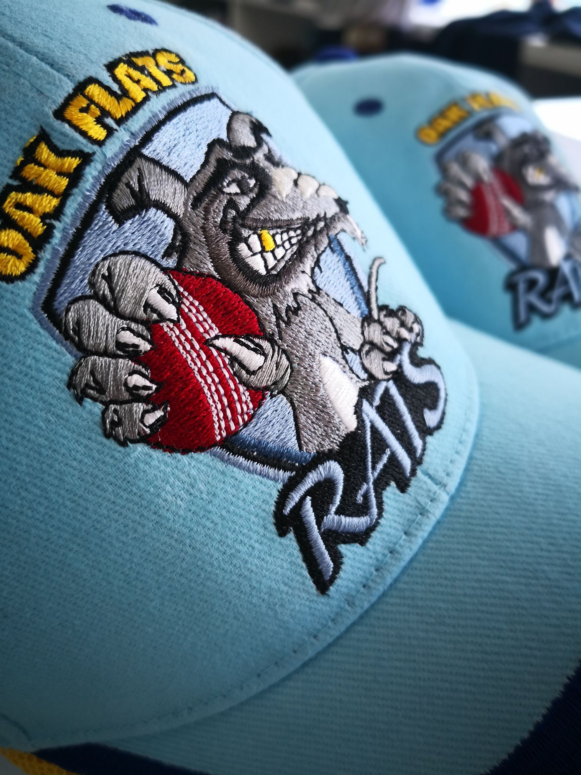 A Blue Hat With Embroidered With the Word Rats on It — NMTG Embroidery In Wollongong, NSW