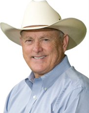 A man wearing a cowboy hat and a blue shirt
