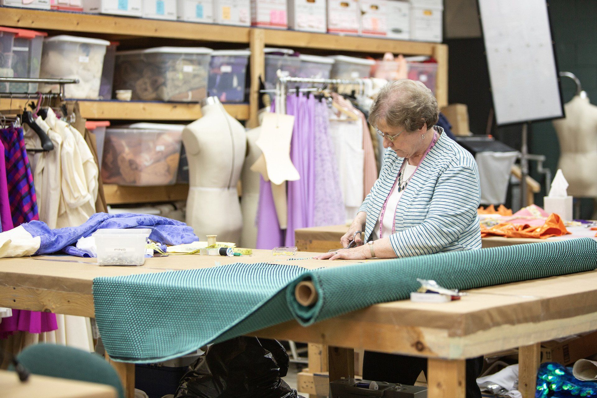 Woman Cutting — Homewood, AL — Sewing Machine Mart