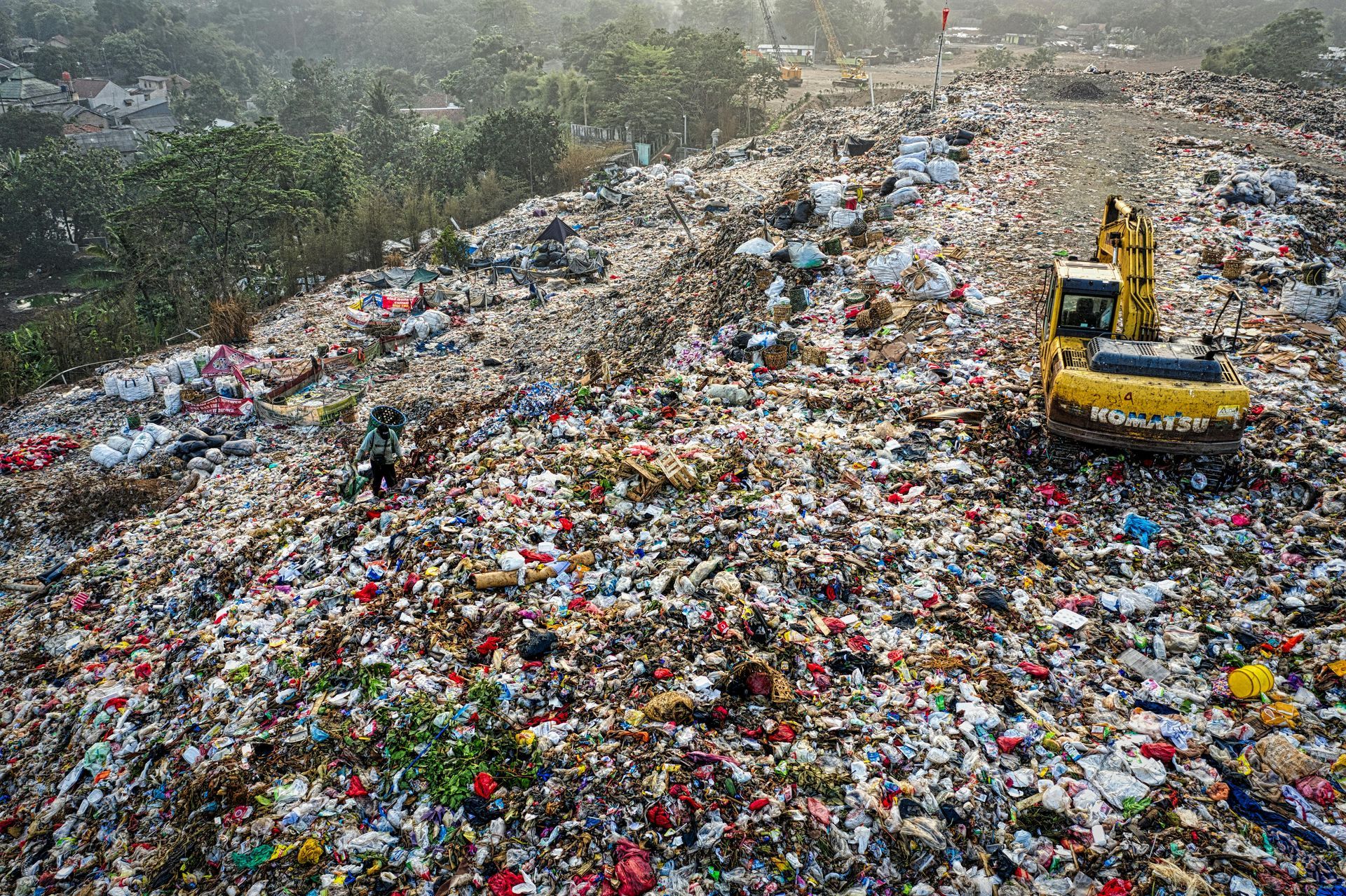 An aerial view of a dumpster filled with lots of trash.