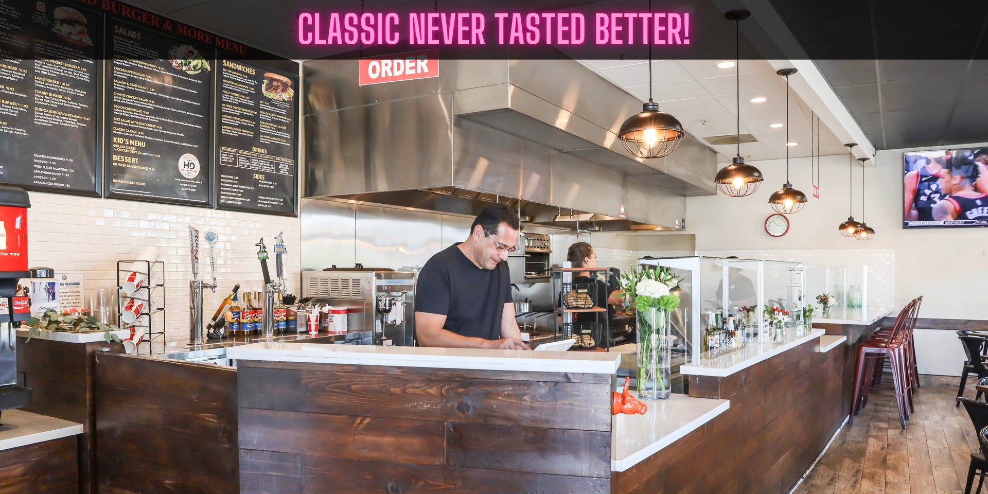 HD Burger & More inside view with a person at the cash register.