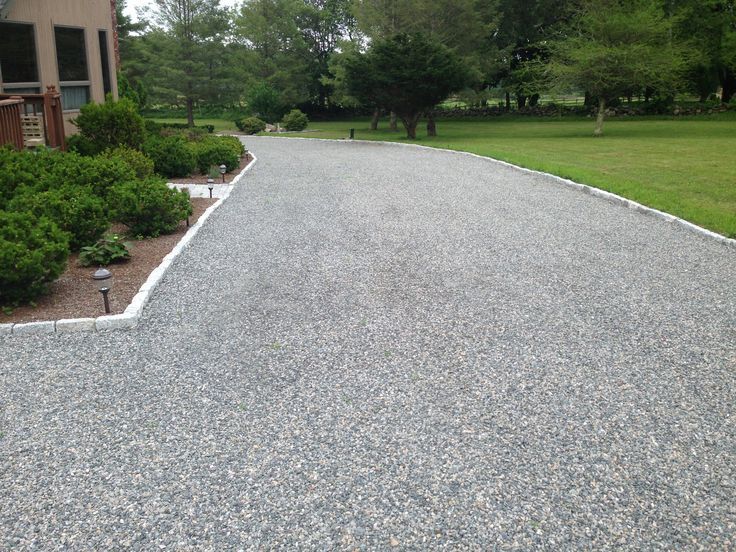 Patio under construction; paving stones scattered. A person in the background.