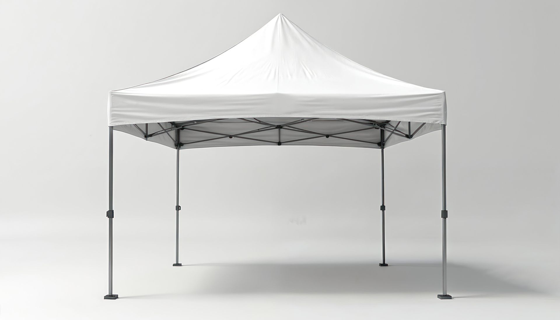 White pop-up canopy tent with four legs on a plain gray background