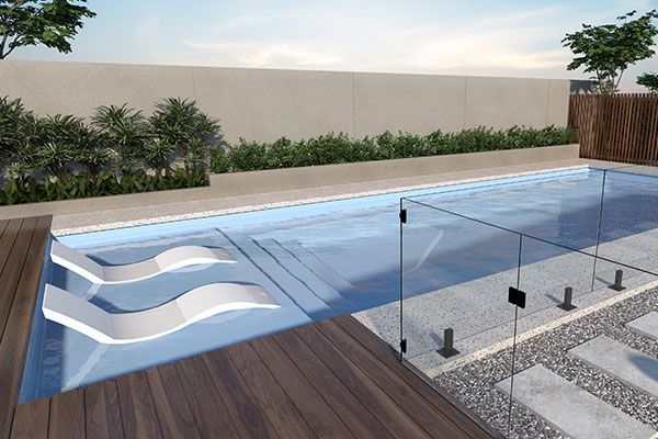 Modern backyard pool with built-in steps, glass railing, wood deck, and landscaped plants