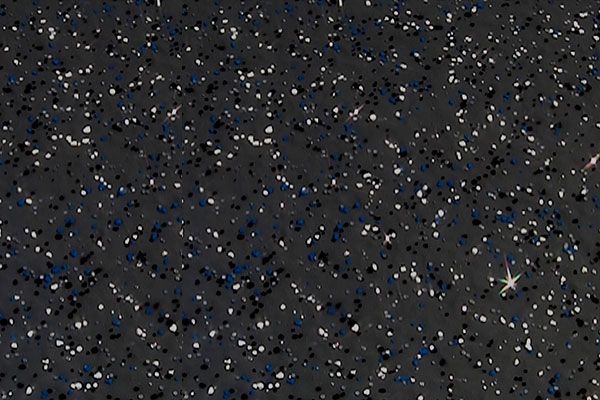 Dense star field in a dark sky, with many faint stars and a bright star near the right side.