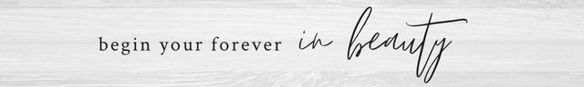 “Begin your forever in beauty” text on a light wood background with a handwritten script accent