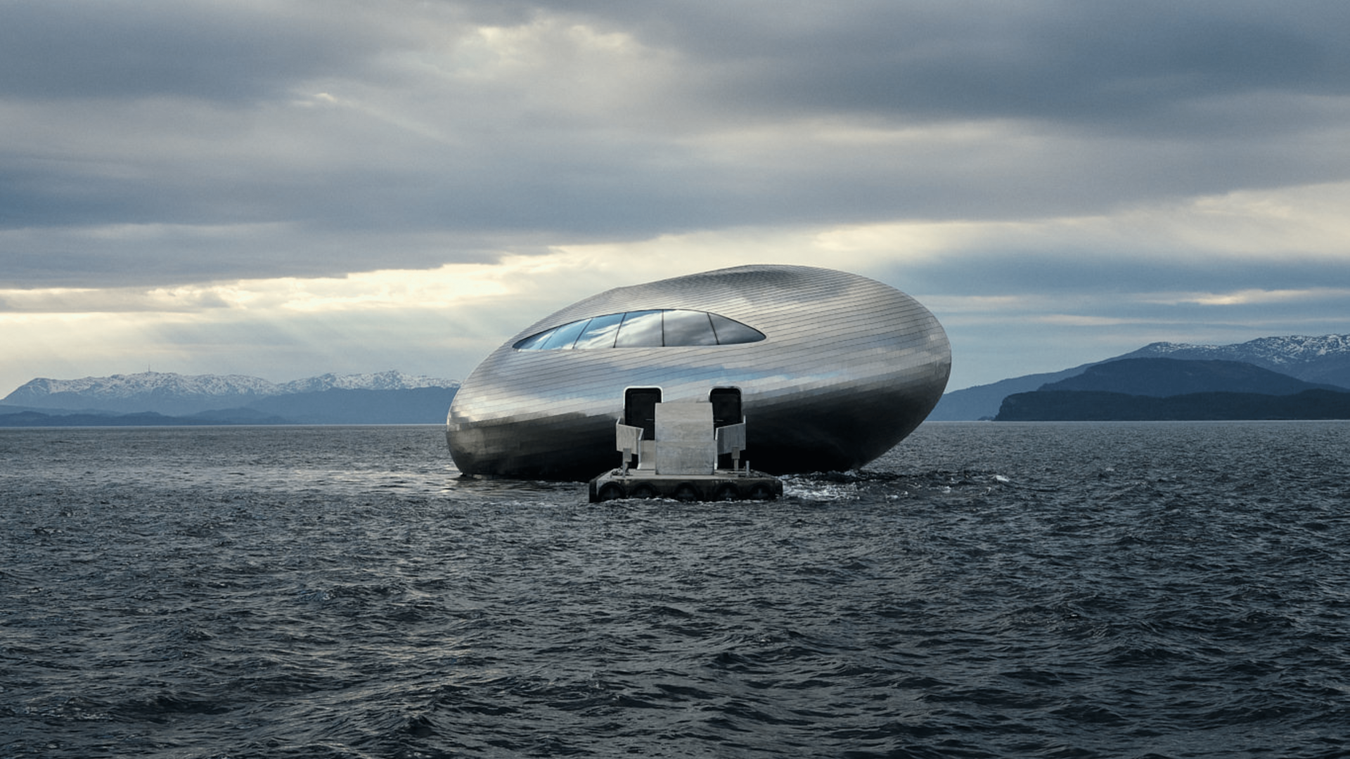 A spherical, metallic building floating on water with a dark sky and mountains in the background.