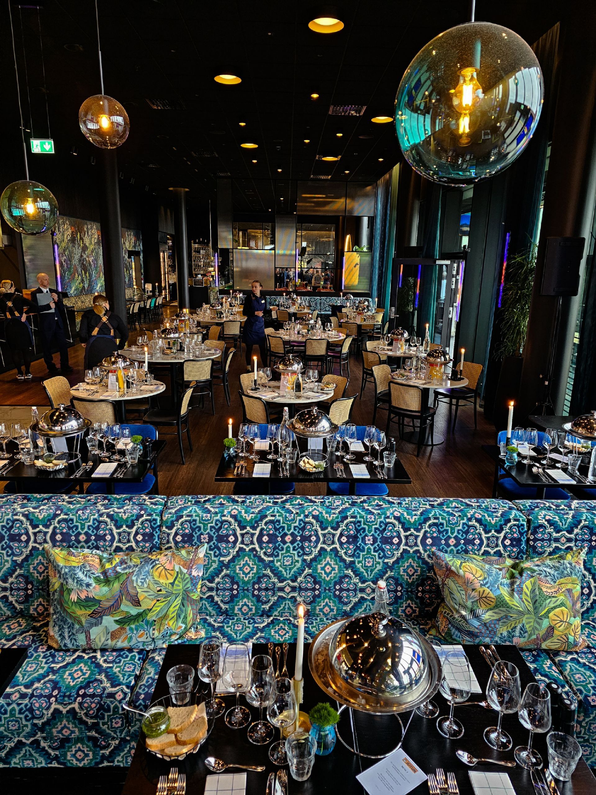 Seafood display: shrimp, crab legs, lobster, and lemons.