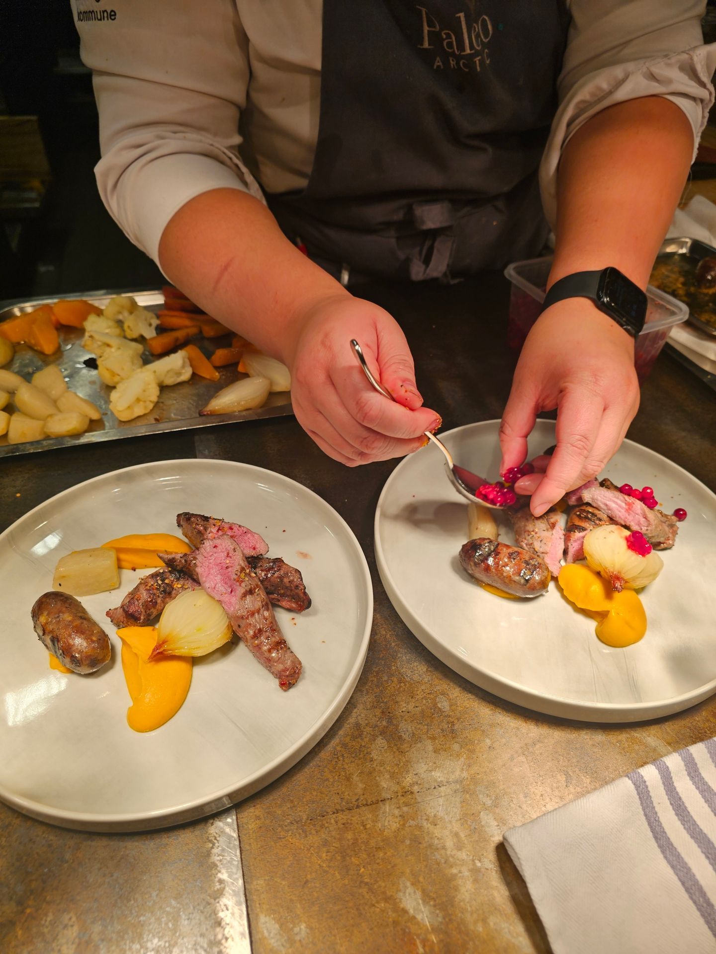 Creamy seafood soup in a blue and white bowl, drizzled with olive oil, on a wooden table.