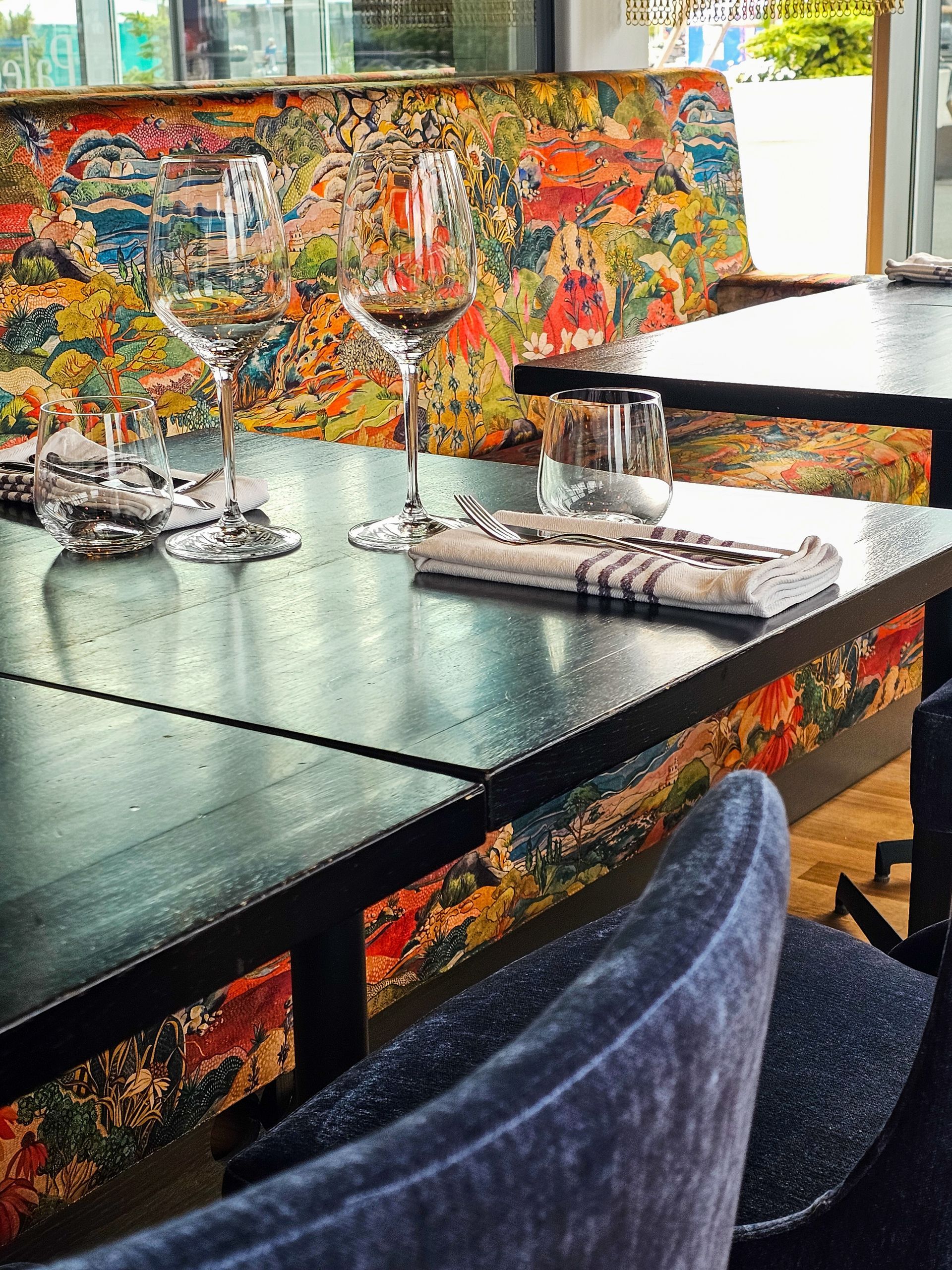 Seafood display: shrimp, crab legs, lobster, and lemons.