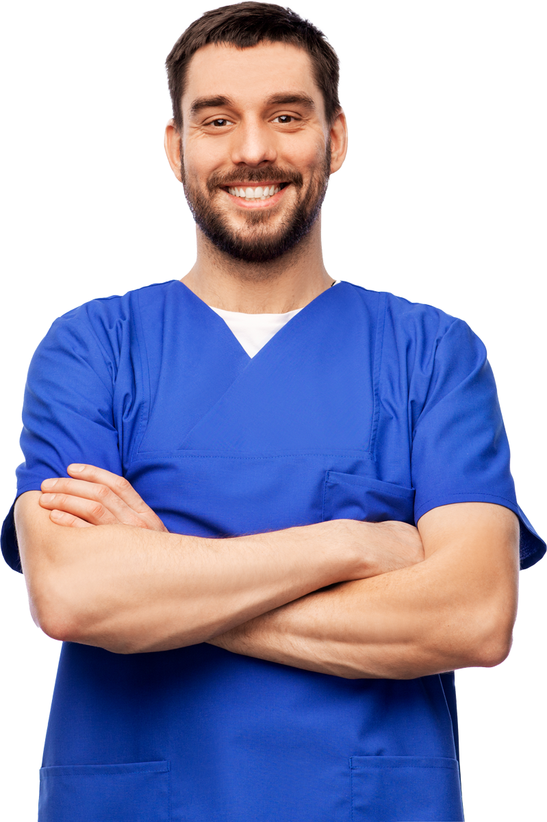 Man in blue scrubs, arms crossed, smiling.